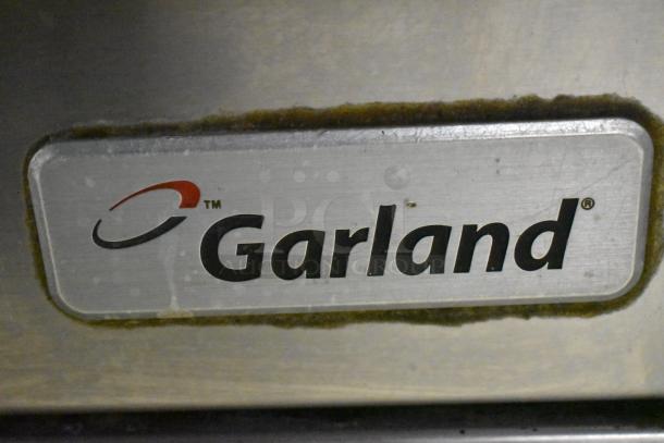 Garland Stainless Steel Commercial Gas Vertical Broiler, showing brand label, durable construction, slightly worn condition.