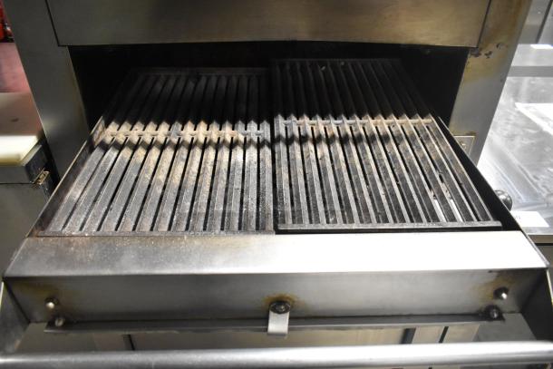 Garland Stainless Steel Commercial Gas Vertical Broiler, featuring grill grates, in used condition. Ideal for high-volume cooking.