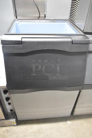 Stainless steel commercial ice bin, excellent condition, top-loading, robust build, suitable for high-capacity storage.