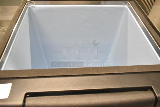 Stainless steel commercial ice bin in excellent condition, features durable construction and ample storage space.