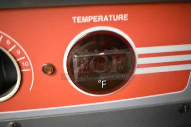 Close-up of Metro C5HME053968's temperature control dial, marked in Fahrenheit. Red panel with numerical display.