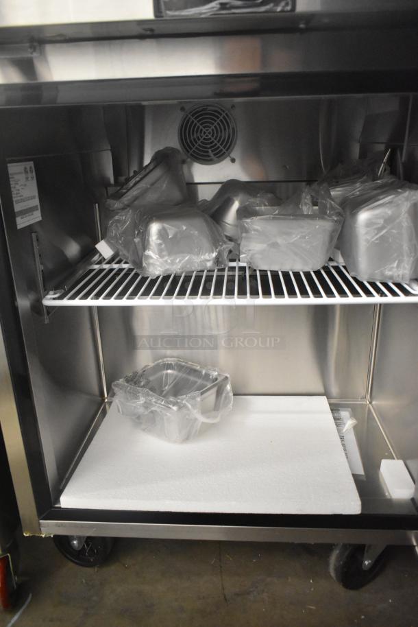 2021 Atosa MSF8301GR stainless steel prep table with storage, shelves, and commercial casters. New condition, 115 volts.