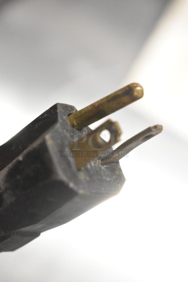 Close-up of a power plug for the Auto Fry FFG-10 ventless fryer, showing three metal prongs. Used condition.
