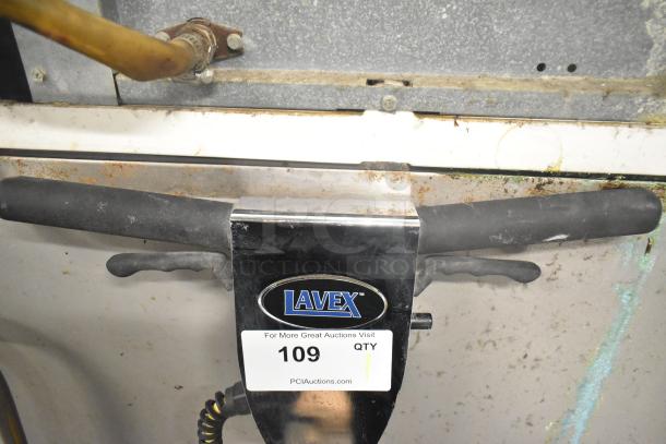 Brand new Lavex commercial floor burnisher, 115 volts, metal, with minor scratches and dents, auction tag visible.