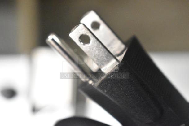 Close-up of a power plug for the Avantco 177CO14 stainless steel convection oven.