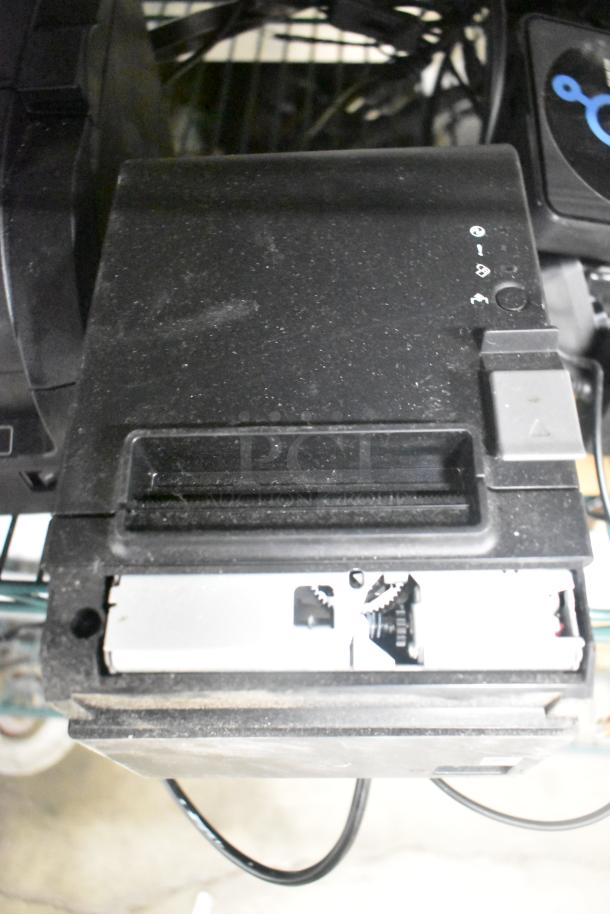 SNBC BTP-M300 receipt printer in used condition, visible wear. Features front paper slot and control panel symbols.