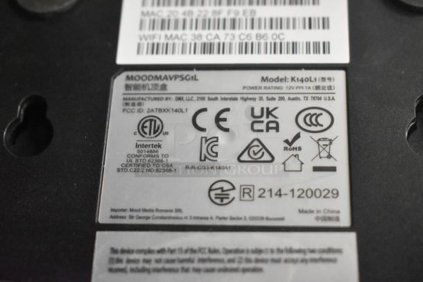 Label on electronic device, model K140L1, with certifications and manufacturing details, including FCC and RoHS compliance.