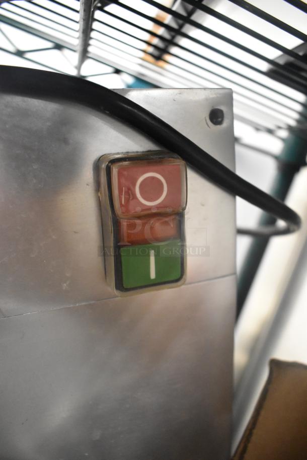 AvaMix 177CFP5D metal commercial food processor power switch detail, showing red off and green on buttons.