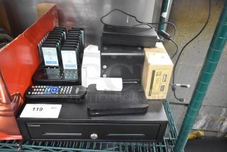 Various tech items including Toast metal cash drawer, Cisco router, Toast Go 2 tablet, TP200 printer, and pager system with 19 pagers, all in used condition.