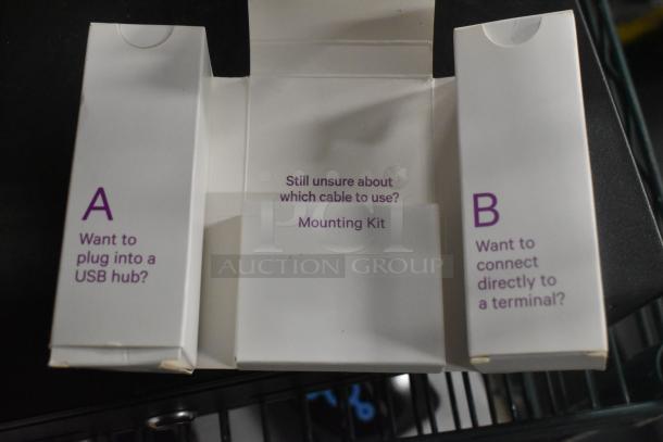 Box with labels “A” for USB hub, “B” for terminal, and “Mounting Kit” instructions inside.