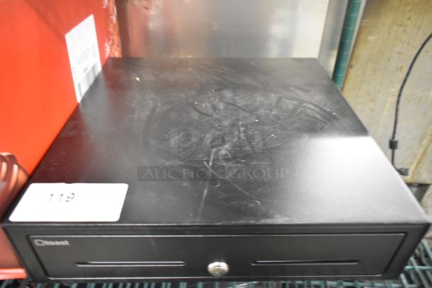 Black Toast metal cash drawer with lock, slightly scratched surface, marked "Toast" and labeled with "119."