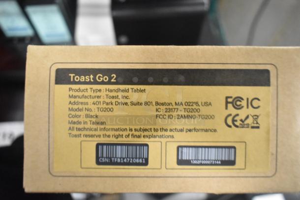 Label for Toast Go 2 Handheld Tablet, Model TG200, black, by Toast Inc., made in Taiwan, showing product and FCC details.