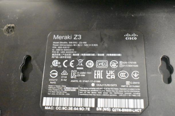 Cisco Meraki Z3 label showing model Z3-HW, power specs, and regulatory certifications. Serial and part numbers visible.
