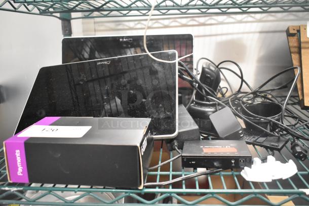 6 various items including two Toast POS system monitors, Symbol barcode scanner, Toast Tap to Pay card reader. Visible wear.