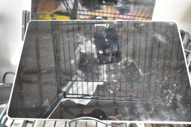 6 items: 2 Toast POS monitors, Symbol barcode scanner, Toast card reader; visible wear, useful for retail setups.