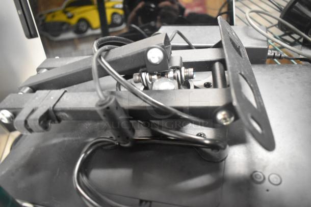 6 assorted items including 2 Toast POS monitors, Symbol barcode scanner, Toast tap-to-pay card reader. Multiple corded components.