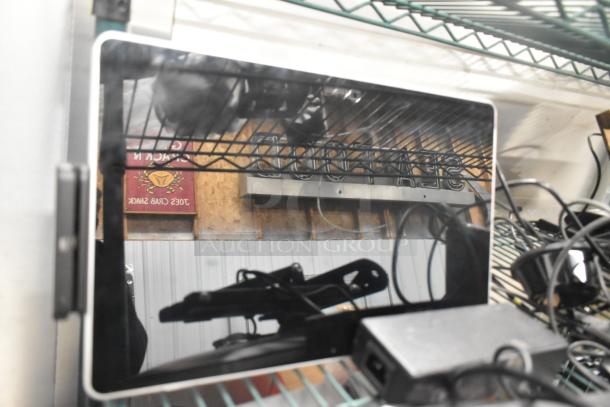 Auction items bundle: 2 Toast POS monitors, Symbol barcode scanner, Toast Tap to Pay card reader. Ideal for retail setups.