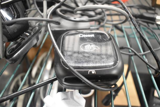6 items including Toast POS monitors, Symbol barcode scanner, Toast Tap to Pay card reader. Moderate wear.