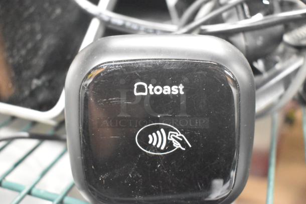 6-item bundle featuring Toast POS monitors, Symbol barcode scanner, Toast tap-to-pay reader. Signs of use, excellent for retail.