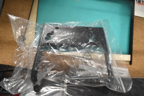 Unifin speaker and Wearson LCD monitor stand in packaging; includes various hardware and accessories.