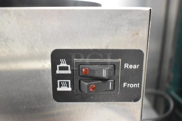 Avantco 177CMA3L stainless steel coffee machine control panel with rear and front burner switches.