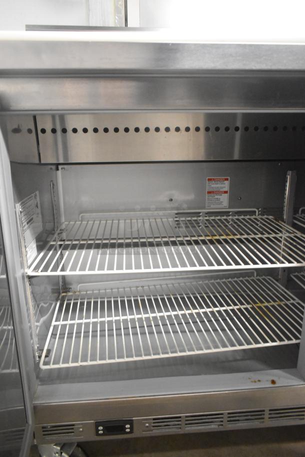 Beverage Air SPE60HC-10 stainless steel prep table with wire shelves, 115V, 1 phase, commercial use, clean interior.