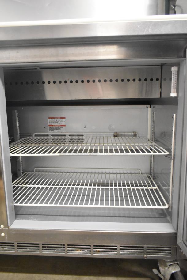 Beverage Air SPE60HC-10 stainless steel prep table, two shelves, commercial use, 115 volts, 1 phase, excellent condition.