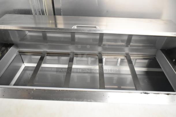 Beverage Air SPE60HC-10 stainless steel prep table with bain marie mega top. Features compartment dividers. Used condition.