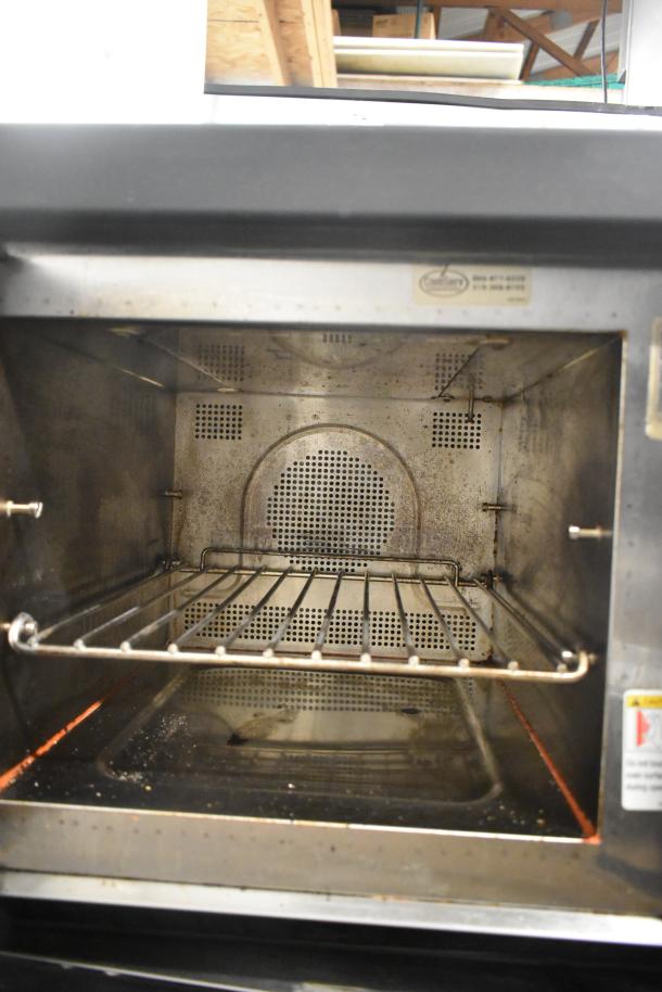 Xpresschef stainless steel rapid cook oven, 208/240V, 1 phase, commercial countertop, interior view, used condition.