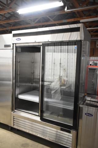 2021 Atosa MCF8703ES Commercial 2 Door Reach-In Freezer; stainless steel; missing left door; poly-coated racks; on casters.