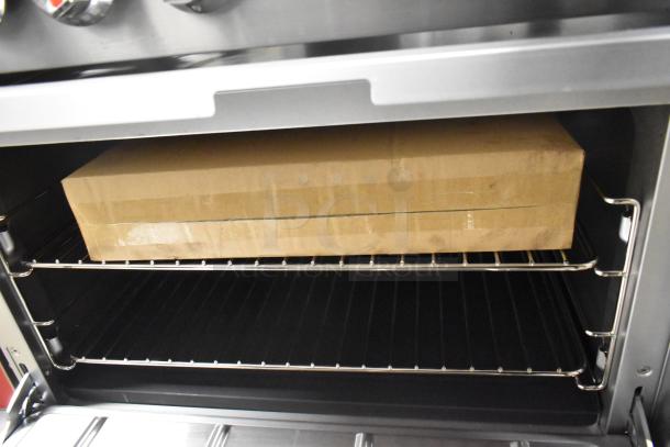 Stainless steel commercial oven interior with a cardboard box on the rack, part of the 2025 CPG 351S60N range.