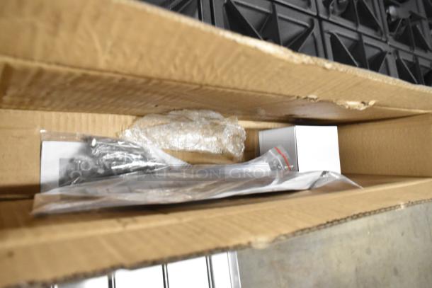 Cardboard box containing components of a new Cooking Performance Group 351S60N 10 Burner 60" Range, parts unwrapped.