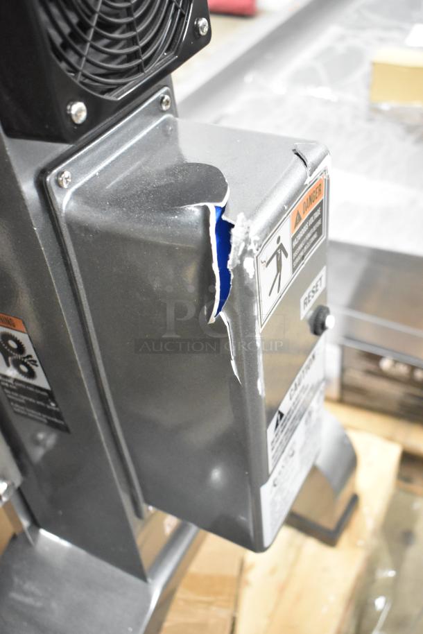 Brand new Avantco 177MX30H 30 Qt. planetary floor mixer with visible dent. Includes mixing bowl, guard, and whisk. 120 Volts.