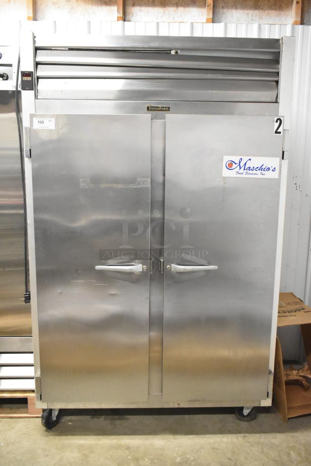 Traulsen G22010 stainless steel 2-door reach-in freezer with poly-coated racks, on casters. 115V, 1-phase.