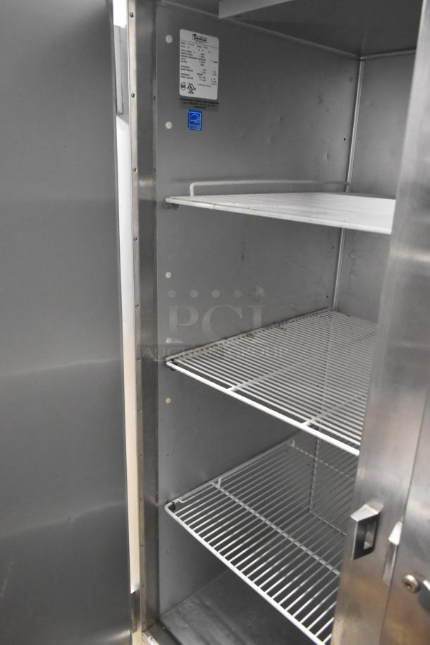 Traulsen G22010 stainless steel 2-door commercial freezer with poly-coated racks and commercial casters, 115V, 1 phase.
