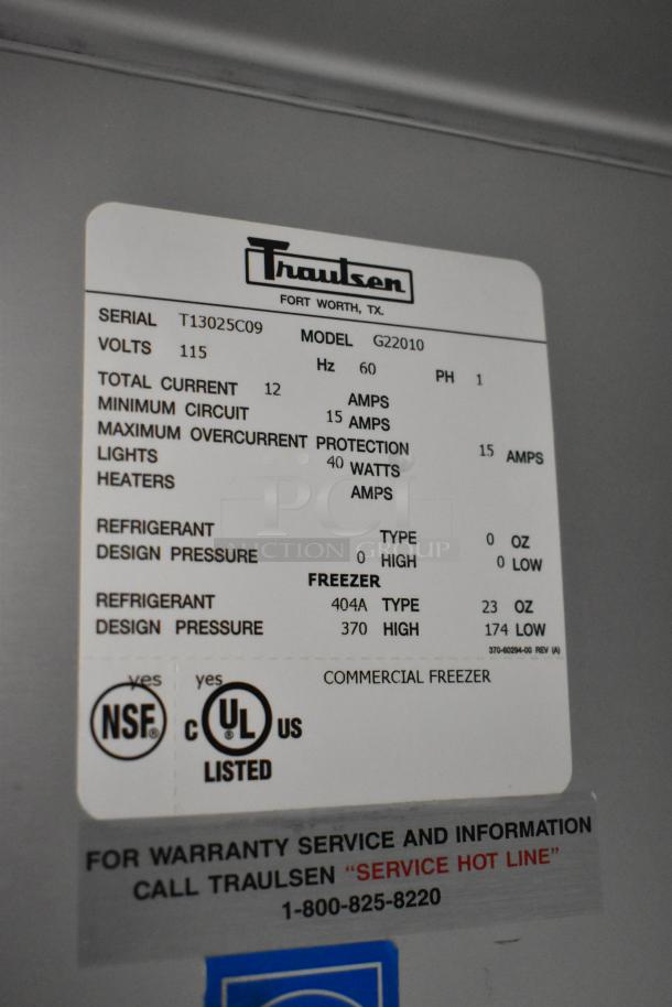 Traulsen G22010 stainless steel commercial 2-door freezer, poly coated racks, on casters, 115V, 1 phase, UL listed.