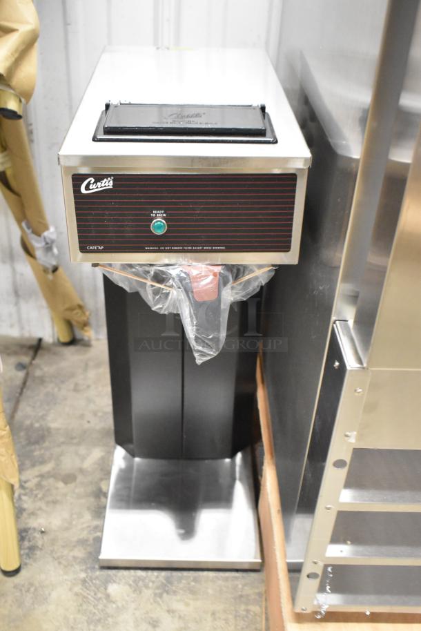 Brand new Curtis CAFE0AP10A000 stainless steel commercial pourover coffee brewer, 2.2L, 120V, 1 phase; slight cosmetic dents.