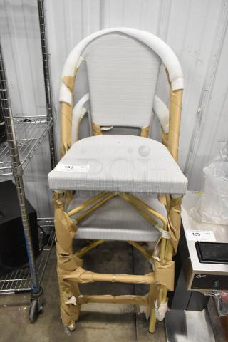 Brand new wooden bar height chair with white backrest and seat. Some minor scratches and dents visible. Auction label 136.