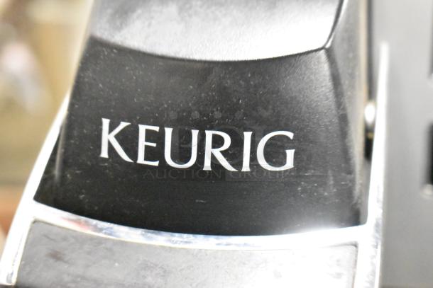 Keurig K150 countertop coffee machine, black, model K150, 120 volts, 1 phase, featuring sleek design and durable build.