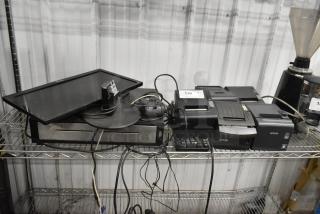 Nine-item lot including metal cash drawer, five Epson receipt printers, computer monitor, and keyboard. Shows wear.