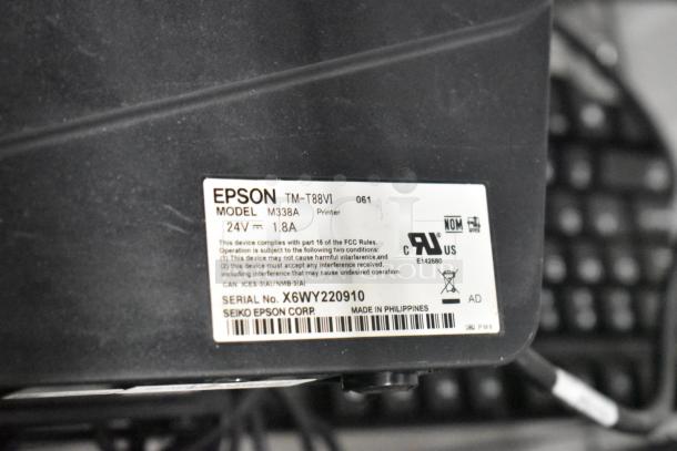 Epson TM-T88VI printer label, model M338A, 24V, 1.8A, serial No. X6WY220910, regulatory compliance markings visible.