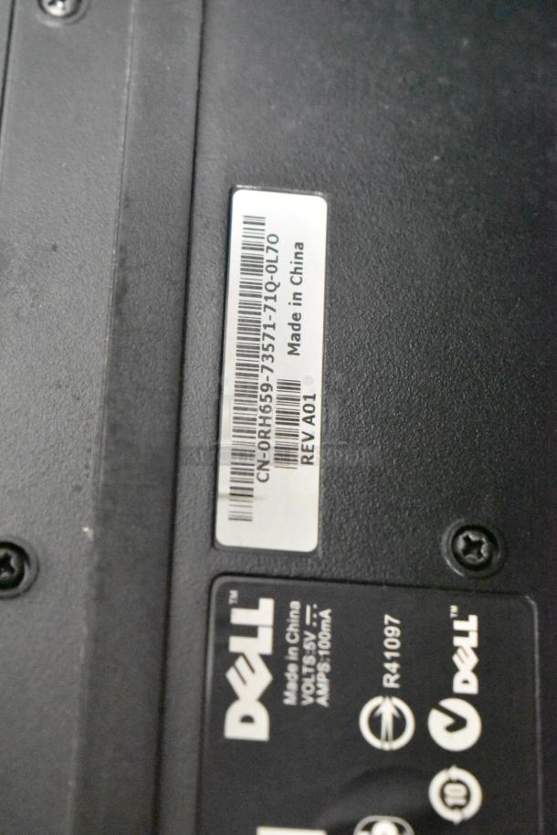 Dell product label on device; includes serial CN-0RH659-73571-71Q-0L70, model R41097, 5V, 900mA, Made in China.