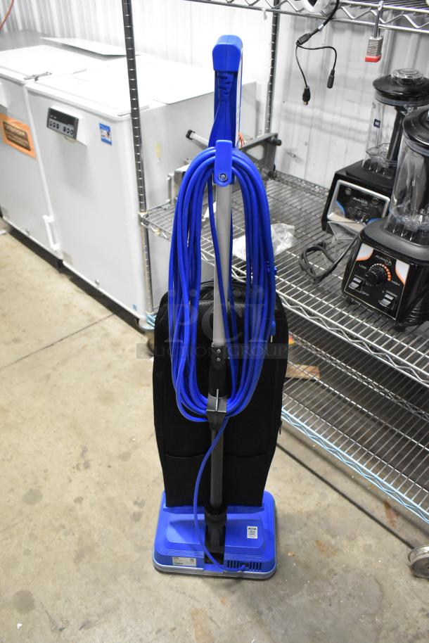 Brand new Lavex 457LWVAC12 upright vacuum cleaner, 12", lightweight, bagged, 120V, blue, minor scratches, long cord.