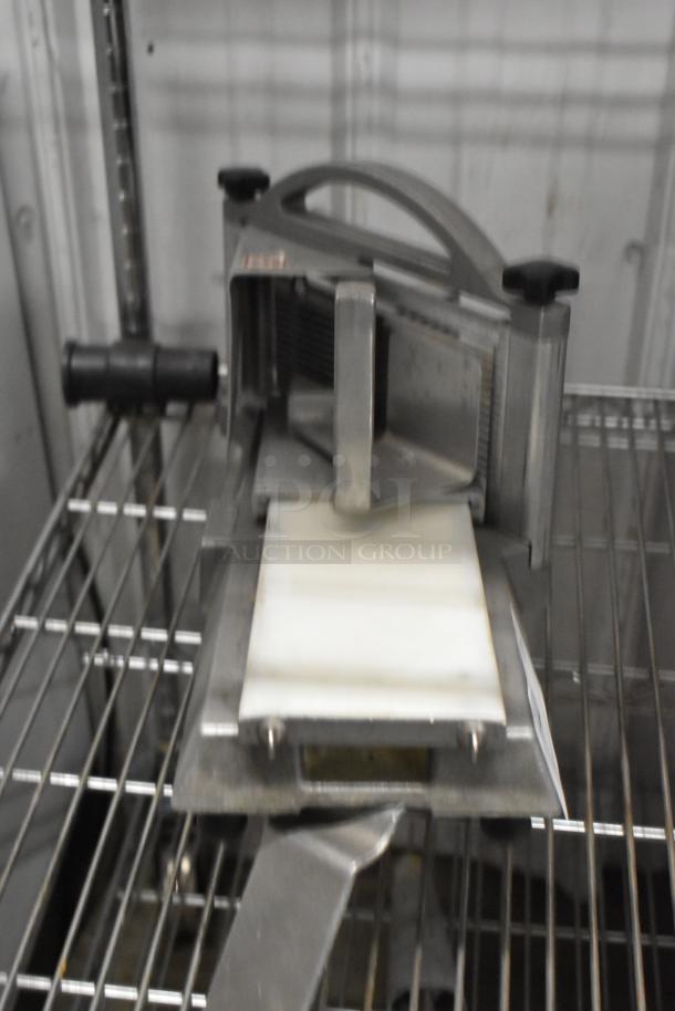 Nemco Metal Commercial Countertop Tomato Slicer, featuring sharp blades, durable metal build, and countertop design. Good condition.