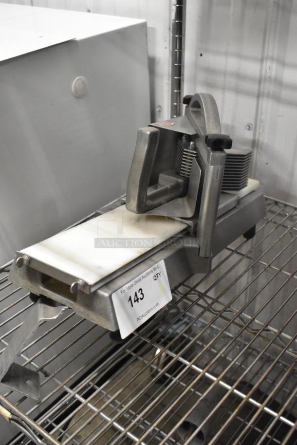 Nemco metal commercial countertop tomato slicer, used condition, stainless steel, model with safety handle and blade assembly.