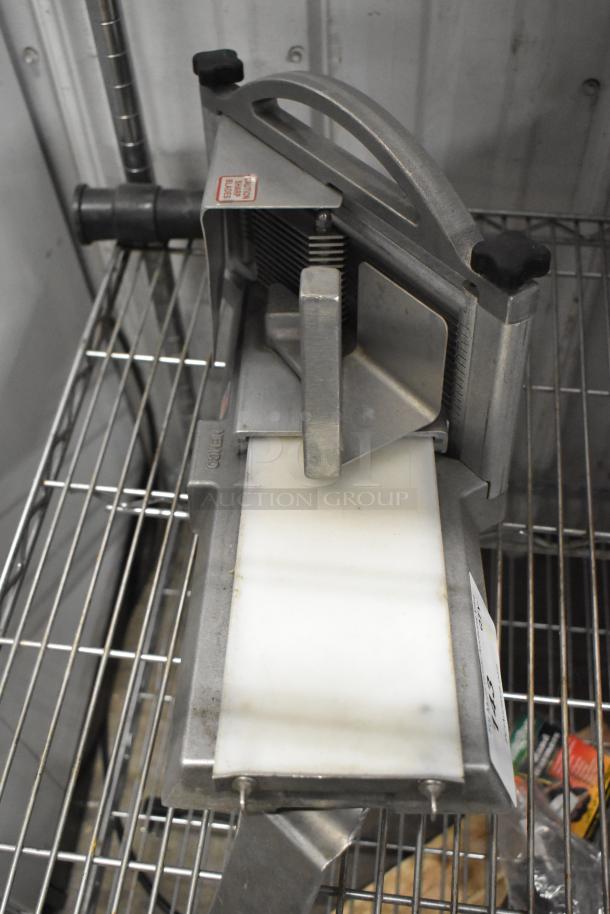 Nemco Metal Commercial Countertop Tomato Slicer in good condition, featuring a sturdy metal frame and sharp blades.