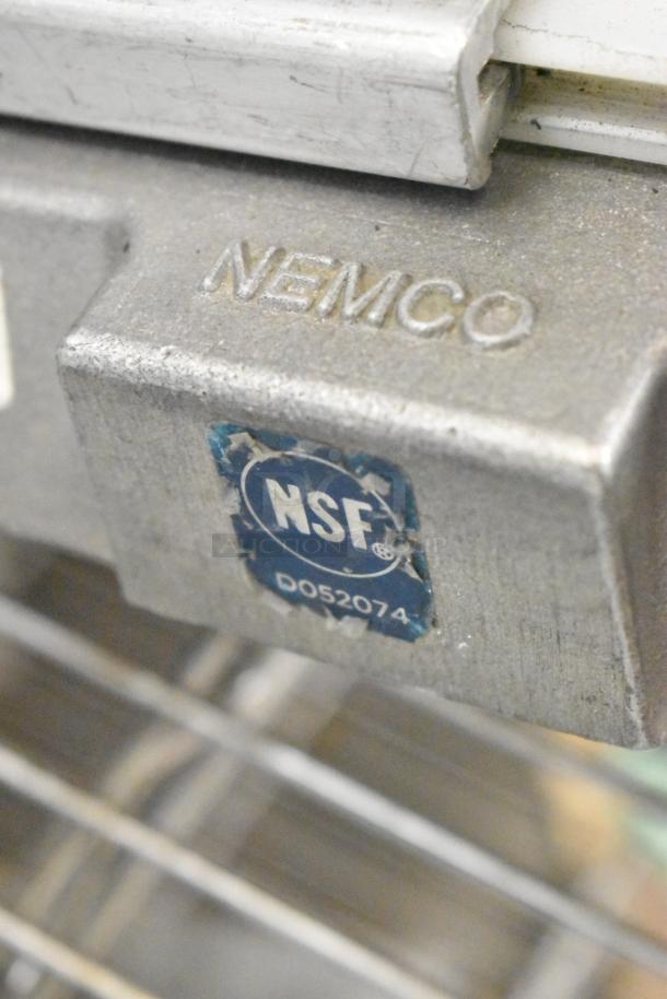 Nemco Metal Commercial Countertop Tomato Slicer with NSF certification label, model D052074. Durable metal construction.