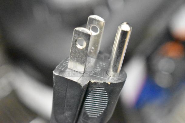 Close-up of a power plug for the AvaMix 928BX1000V blender, showing slight wear.