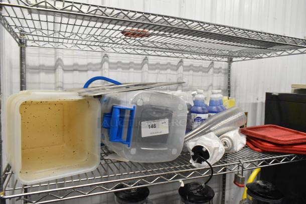 Tier lot on metal shelving; includes poly bins, red lids, Betco Spectaculoso Lavender Cleaner, and assorted items.