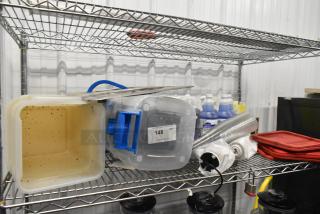 Tier lot on metal shelving; includes poly bins, red lids, Betco Spectaculoso Lavender Cleaner, and assorted items.